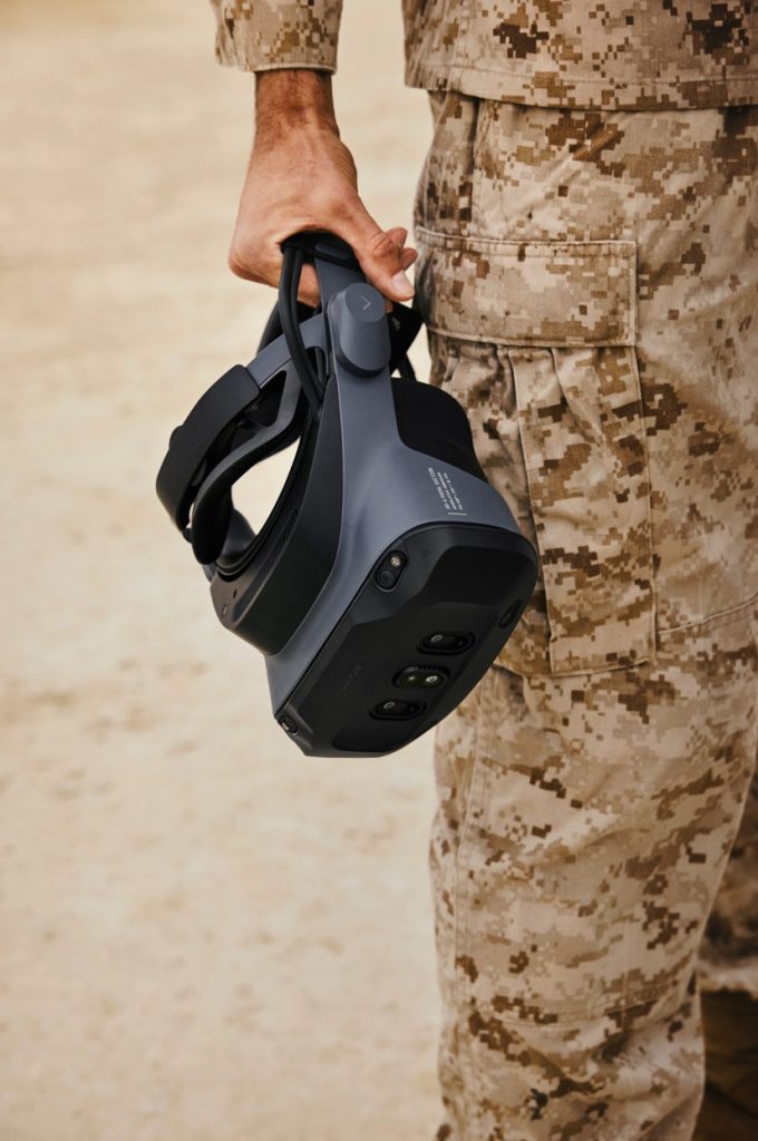 Soldier in camo holding Varjo's newest XR for a training and simulation field exercise